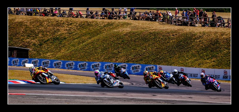 Motorcycle racing action with several riders at Thruxton Circuit